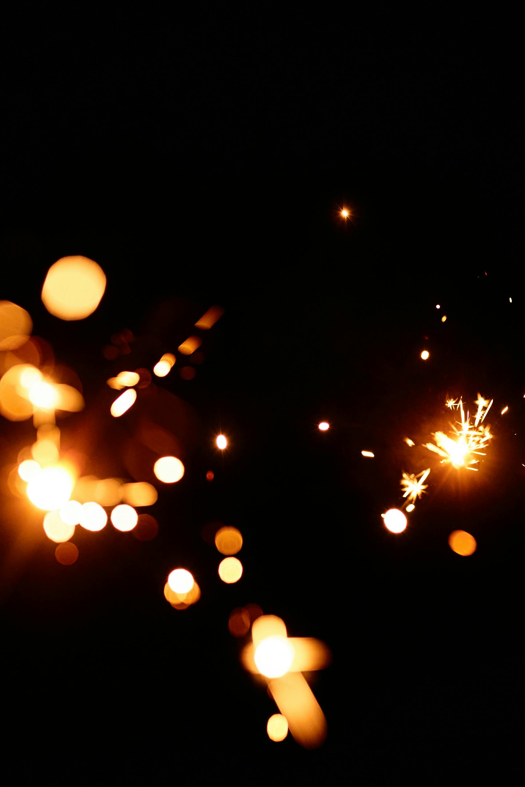 Abstract image of sparkles with dark background, showcasing dazzling lights and shimmering effects.